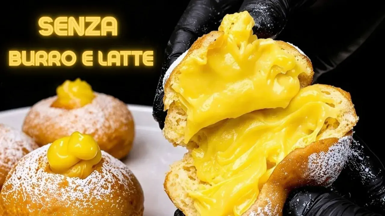 Bomboloni alla crema, soffici e ripieni, senza burro e latte. Un'esplosione di dolcezza.